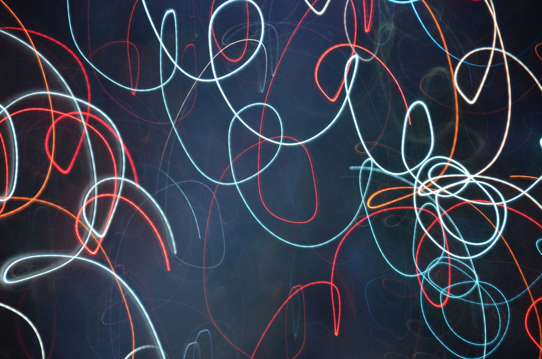 Vibrant abstract light painting captured with long exposure at night.