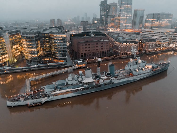 View Of A Warship Moored In A Harbor