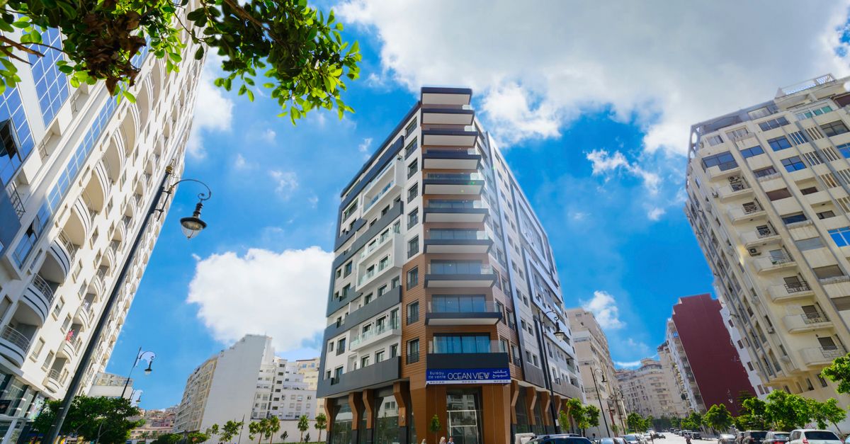 Stunning urban architecture under a vibrant sky in Tangier, showcasing modern city life.