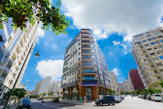 Stunning urban architecture under a vibrant sky in Tangier, showcasing modern city life.