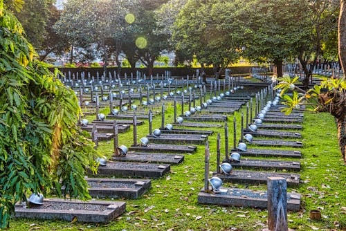 Gravestones with helmets in cemetery