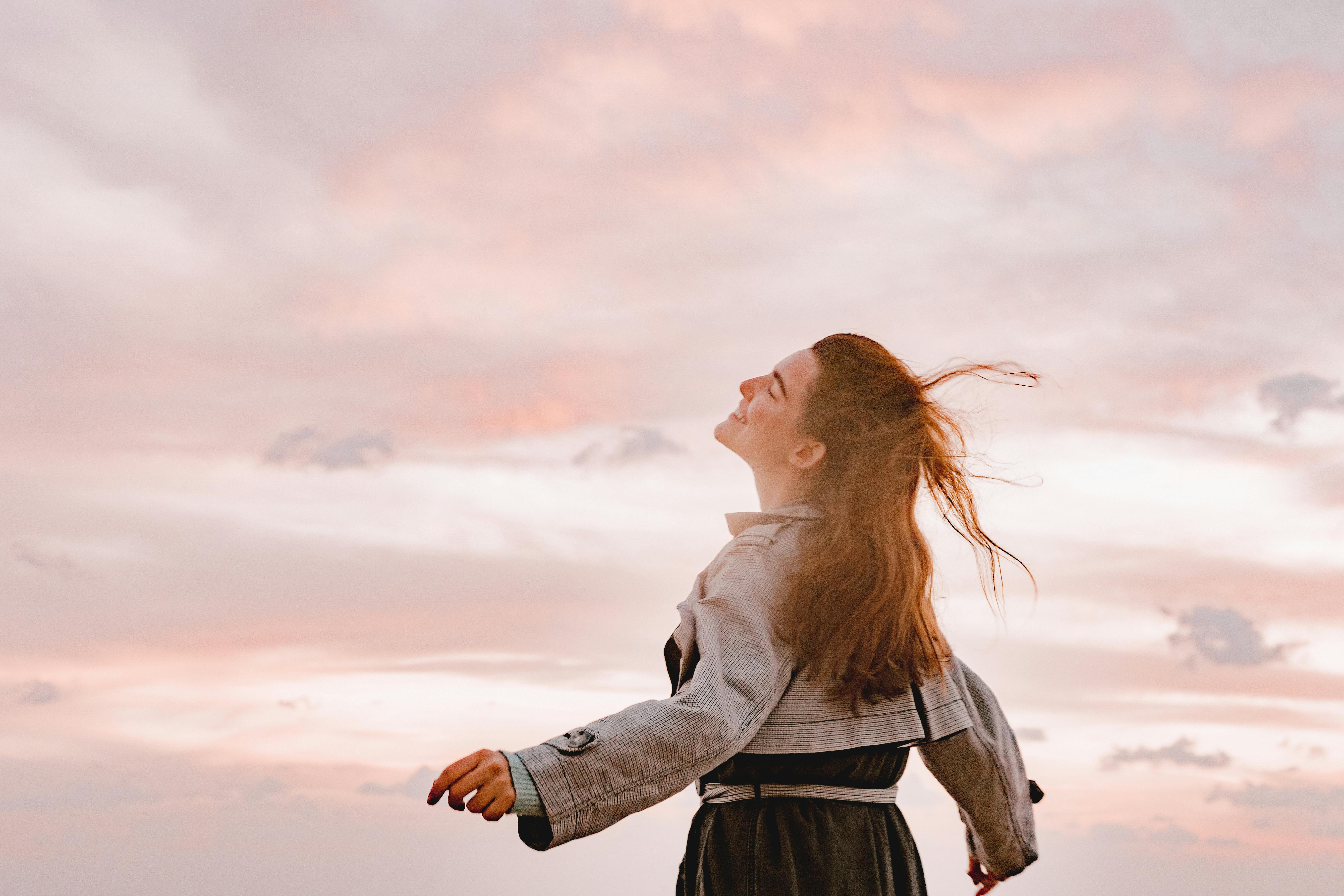 Happy Woman Smiling, Spreading Her Arms and Facing the Sky · Free Stock  Photo