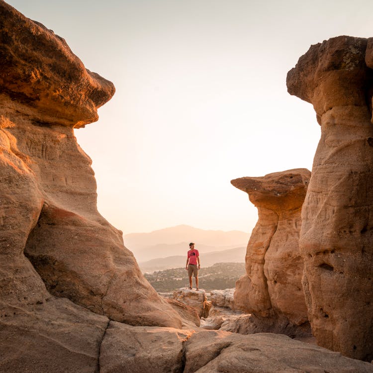 A Person Standing Near The Rock Formations On Pulpit Rock In Colorado Springs, Colorado, United States 