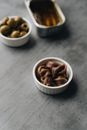 Brown and White Nuts in White Ceramic Bowls