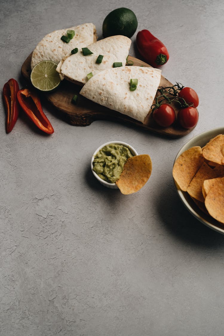 Nachos And Tortilla Dish On White Surface