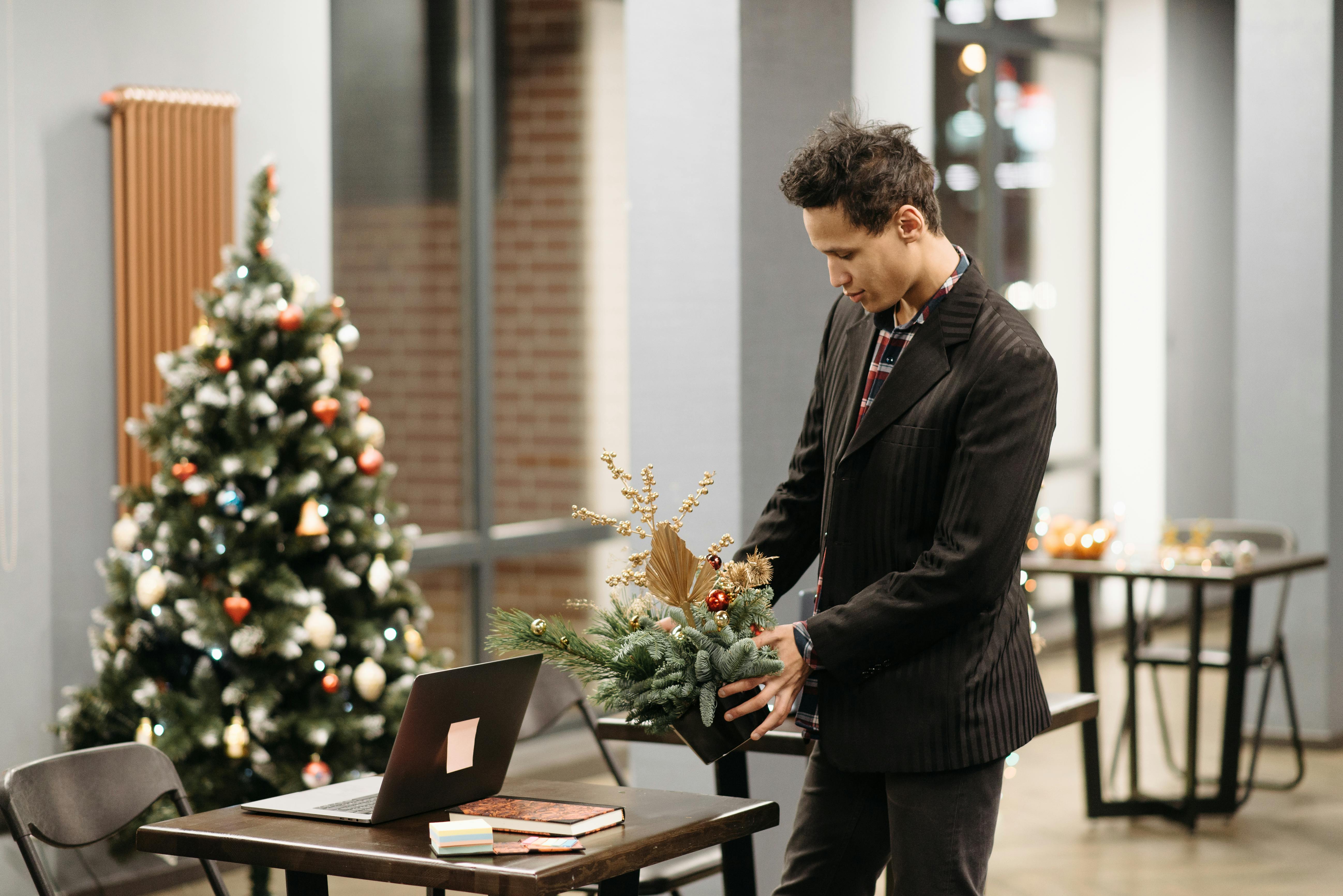 Free Photo of a Man Putting an Ornament on a Table Stock Photo
