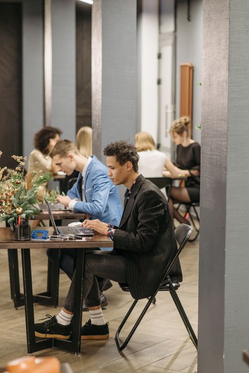Free Diverse team working in a modern office setting with a relaxed atmosphere. Stock Photo