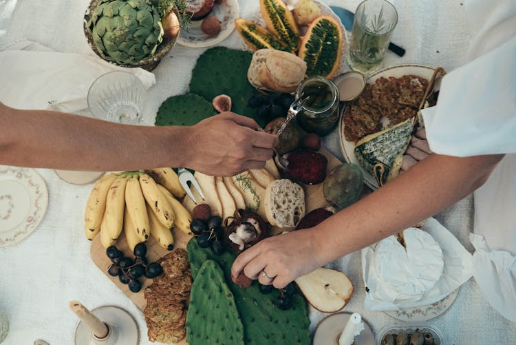 Couple Having Healthy Picnic Together In Summer