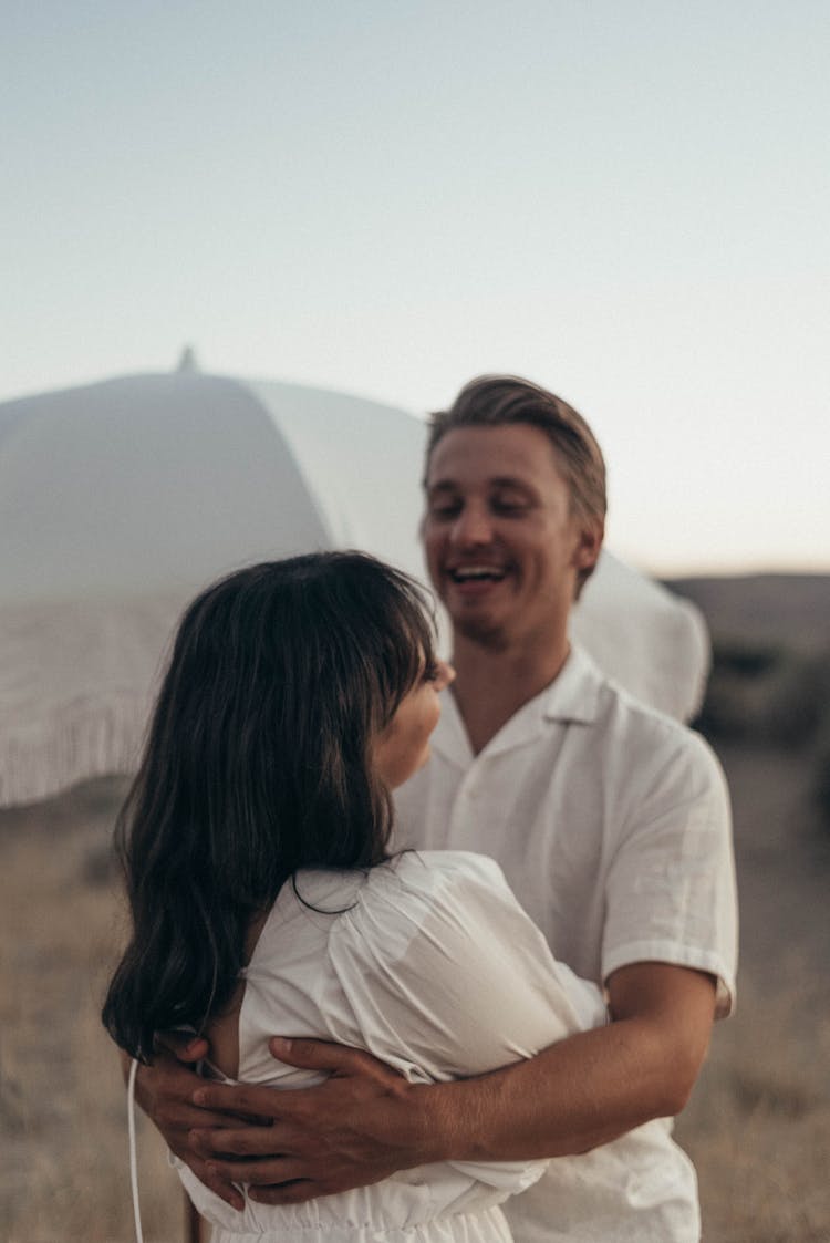 Positive Couple Hugging In Desert Valley