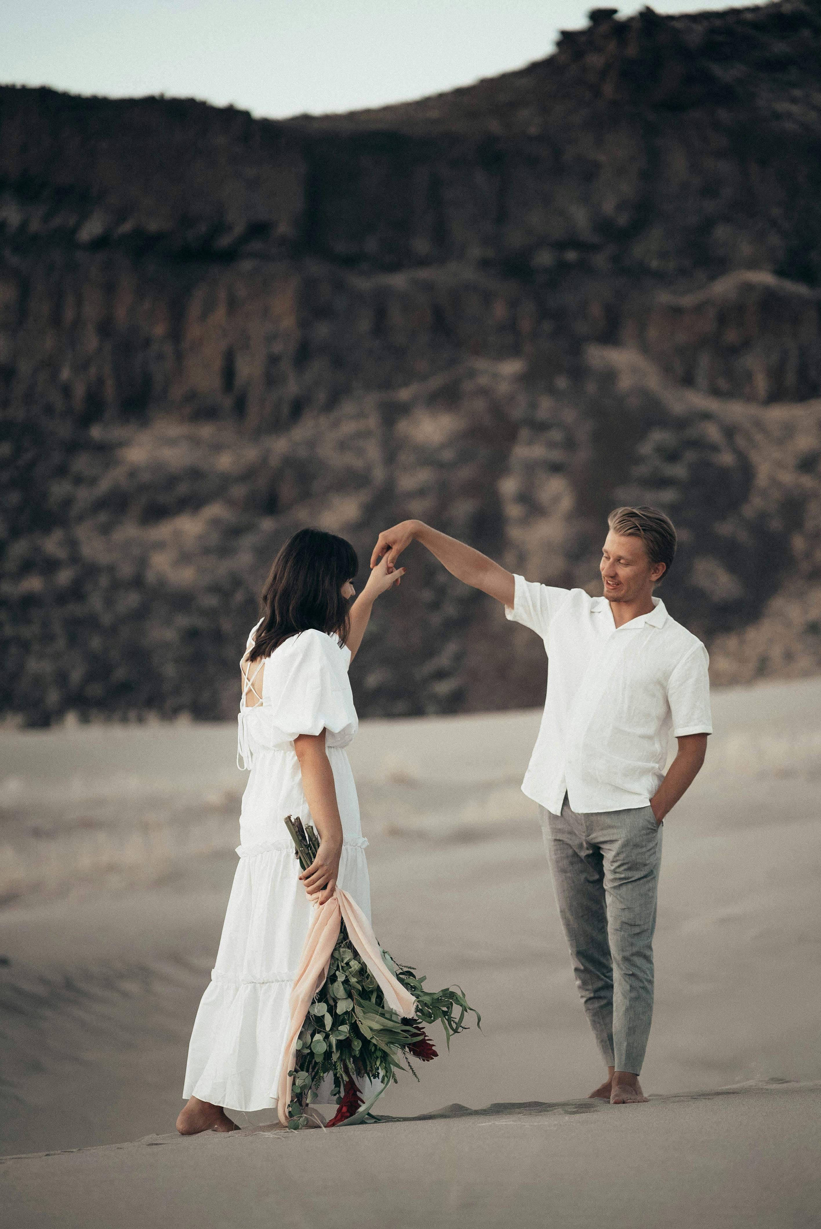 loving newlywed couple on sandy terrain