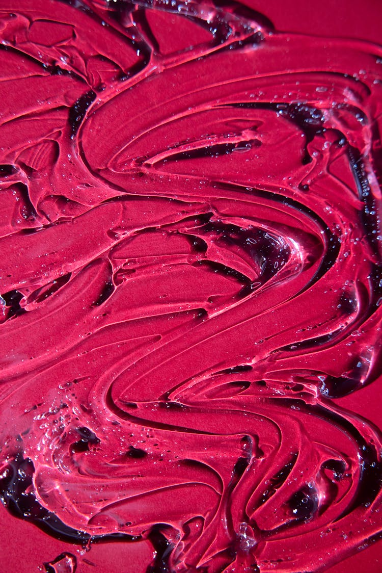 Abstract Background Of Red Paint Flows With Waves