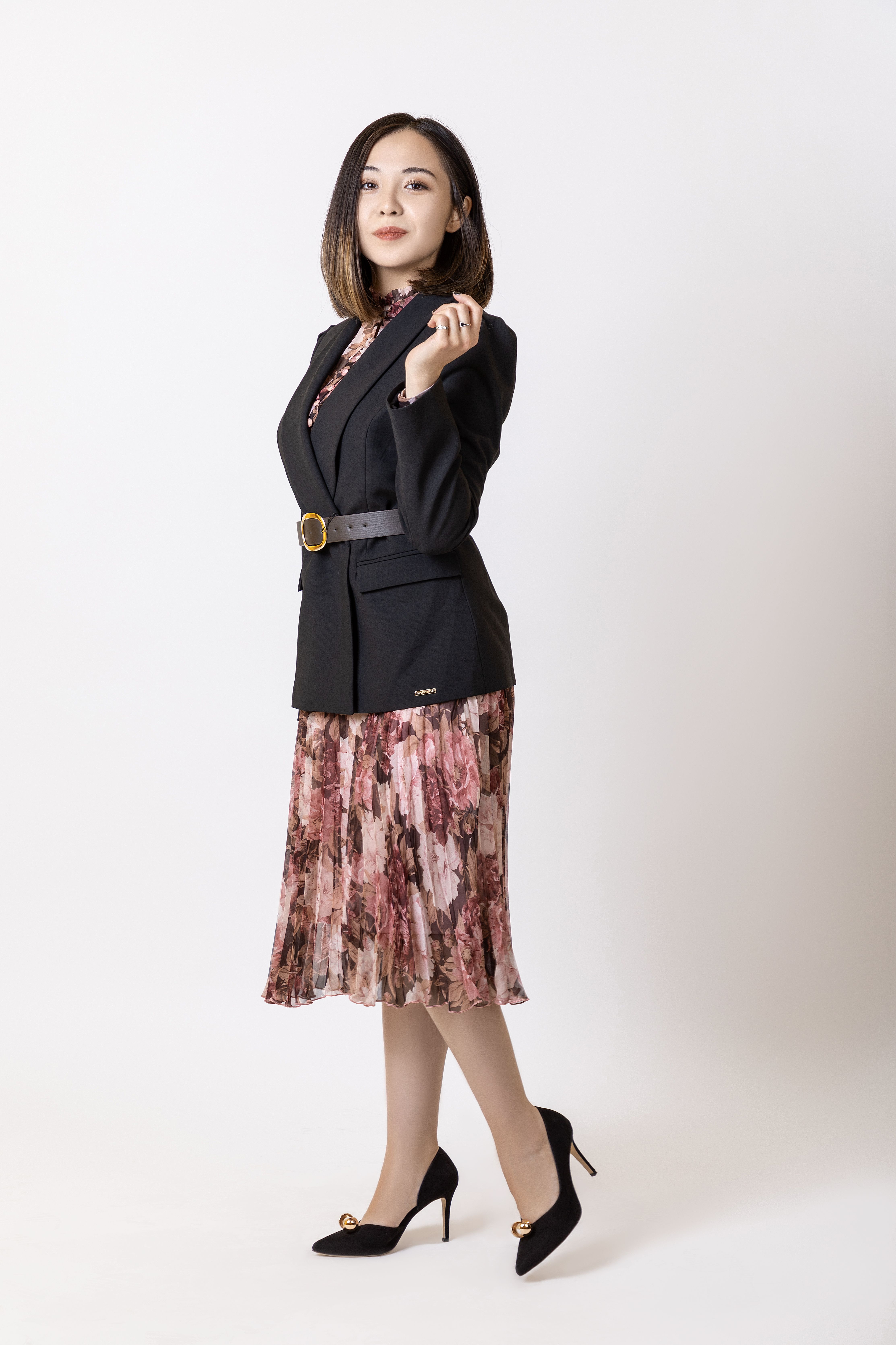 Woman in relaxed blazer with satin slip skirt