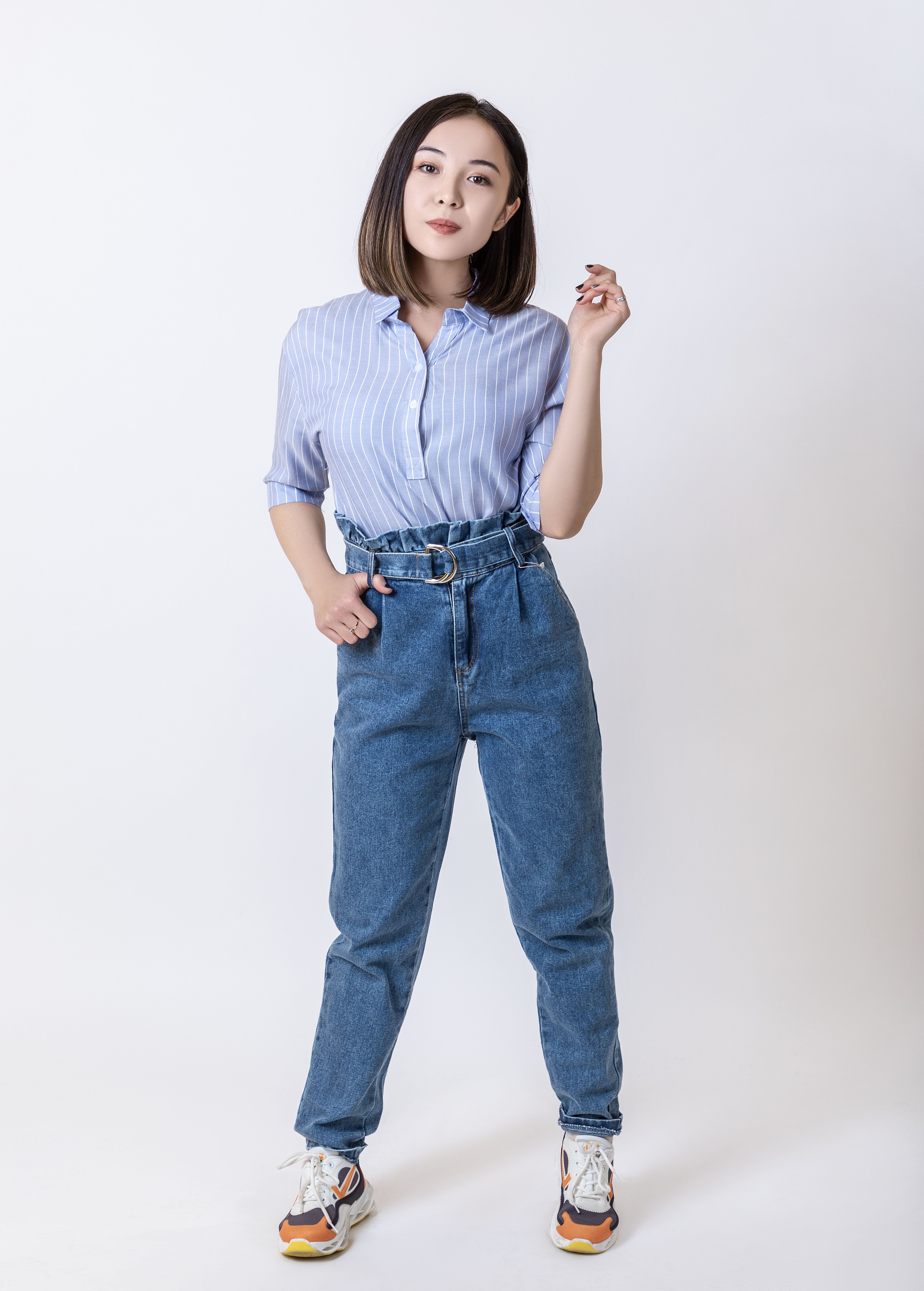 Woman in polished jeans outfit