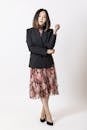 Elegantly Dressed Woman in a Dress and Blazer