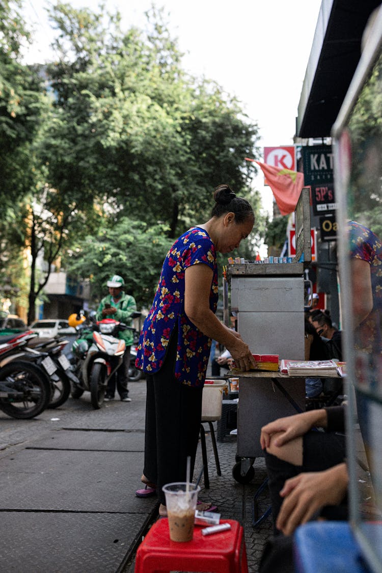 Woman Standing On Street Near Local Store