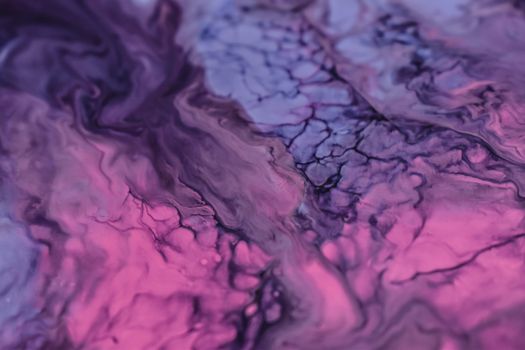 A close-up of swirling vibrant purple and pink marble textures with intricate patterns.