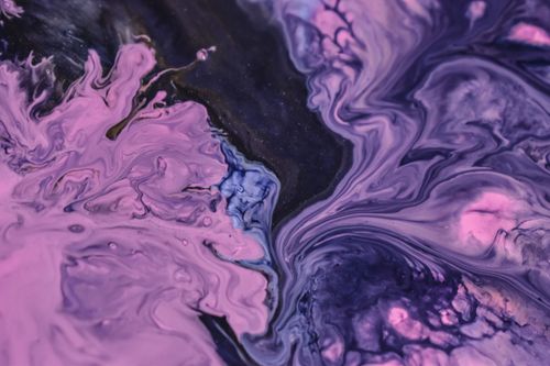 Free Vibrant swirl of purple and pink paint creating a dynamic abstract pattern. Stock Photo