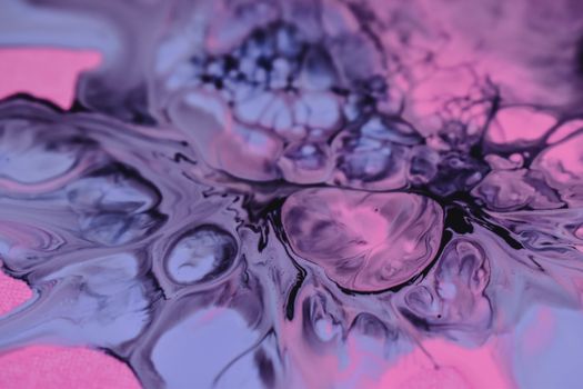 Captivating abstract fluid art with swirling violet and pink patterns.