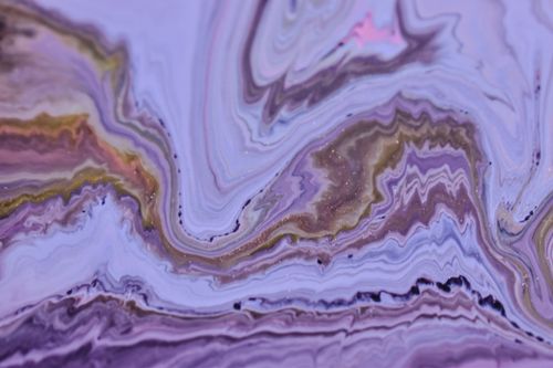 Free Colorful abstract artwork featuring swirling liquid paint patterns with purple hues. Stock Photo