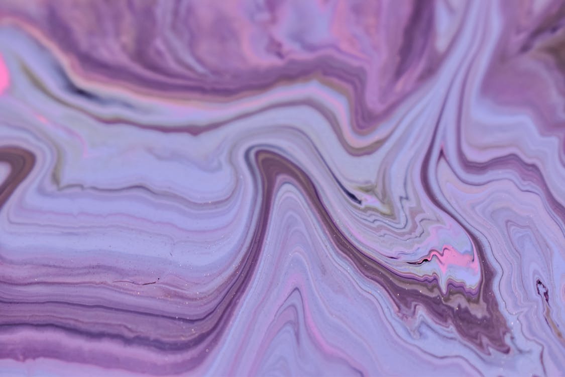 Abstract backdrop of artwork with purple paint streams