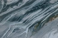Abstract backdrop of artwork representing grey paint tones with curved lines and tiny blots