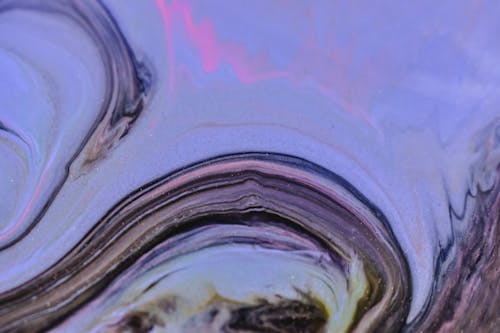 Free Full frame abstract background of dark blue spilled fluids and ink mixing and splattering Stock Photo