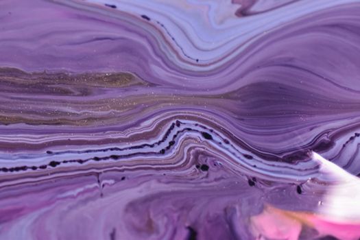 Mix of blue and pink fluids on uneven surface