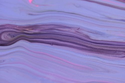 Free Purple paints spilled and flowing on uneven surface Stock Photo