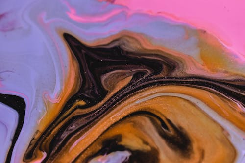 Free Full frame abstract background of flowing black blue and pink paints swirling and mixing smoothly Stock Photo