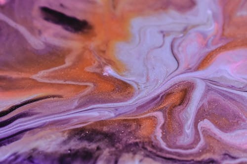 Free Full frame abstract background of spilled purple yellow and white fluids flowing and mixing Stock Photo