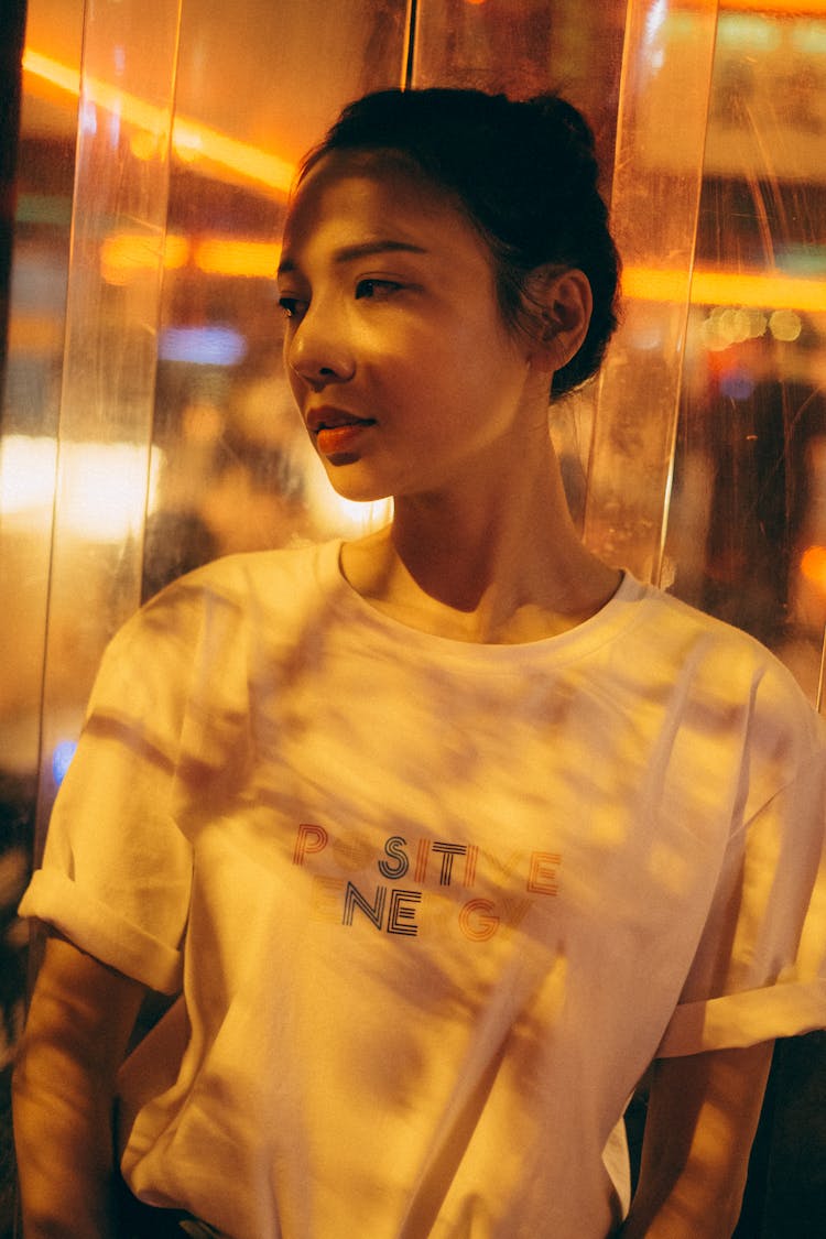 Charming Asian Woman In Casual Wear At Night