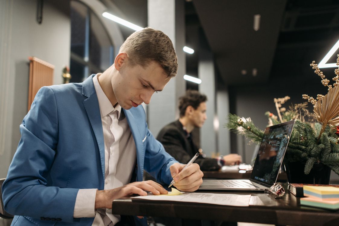 Dude Writing A Man Writing on a Paper · Free Stock Photo