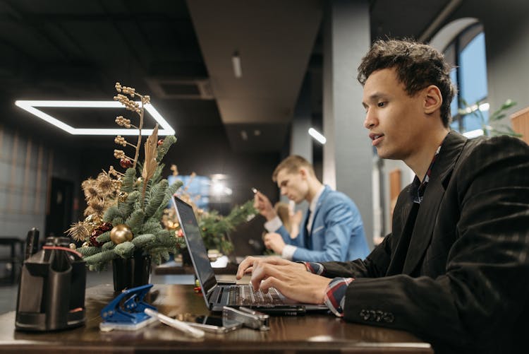 A Man Busy Working On His Laptop