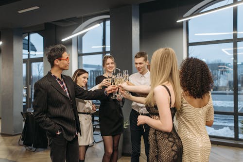 Free Group of Men and Women Doing Glass Toast Stock Photo