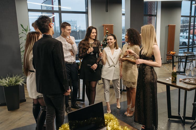 Group Of Men And Women Celebrating Christmas In The Office