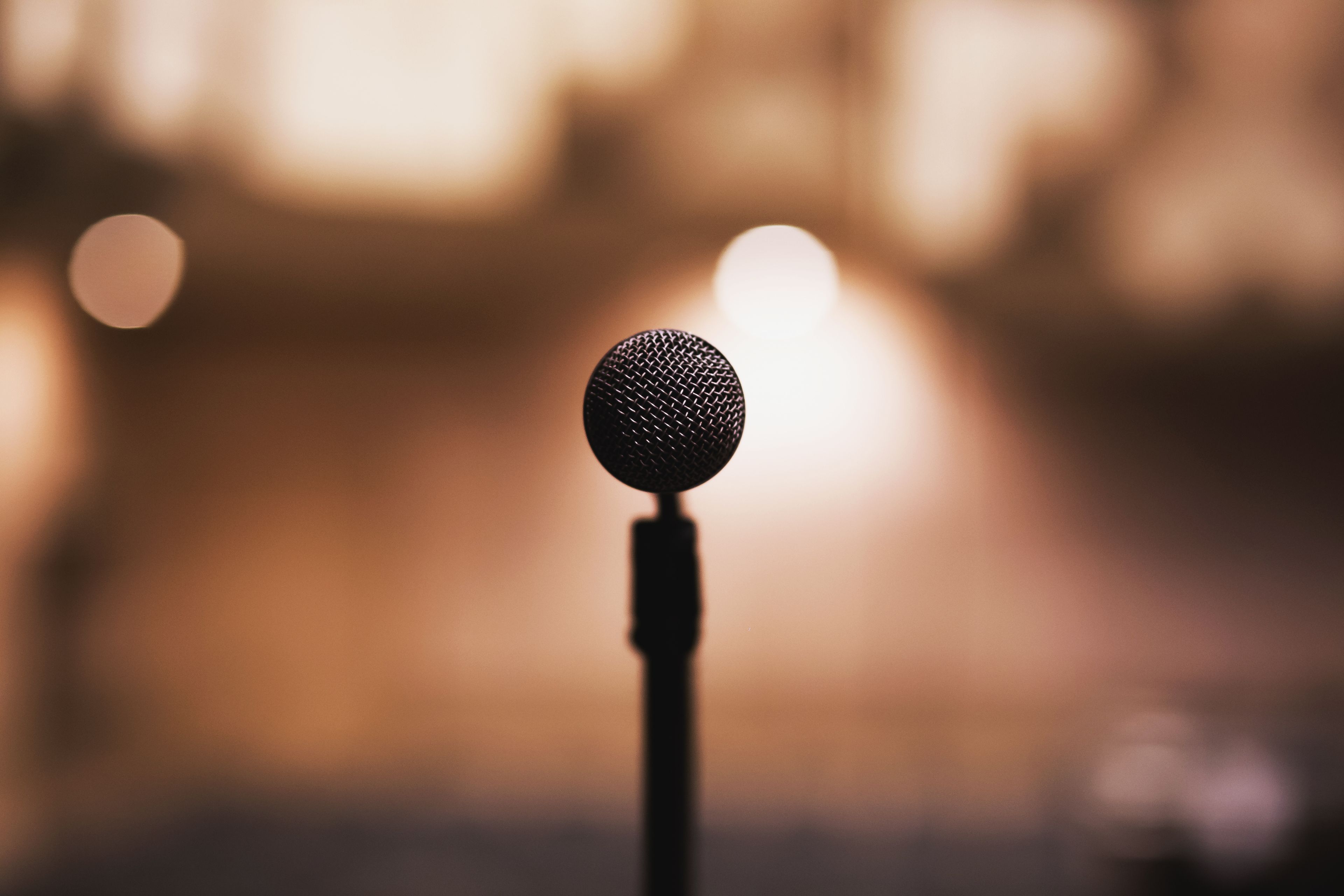 The boom mic in the dark studio