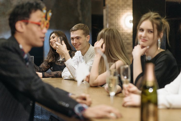 A Team Drinking In A Bar