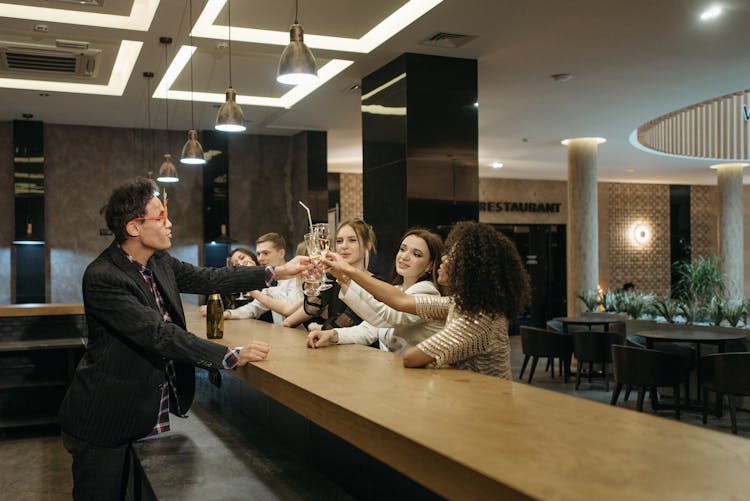 A Team Having A Celebration At A Bar