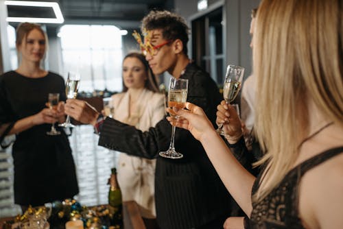 Free People Drinking Champagne in a Party Stock Photo