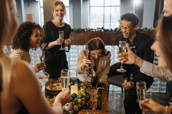 Members raising a glass at the end-of-quarter dinner — photo by Pavel Danilyuk on Pexels