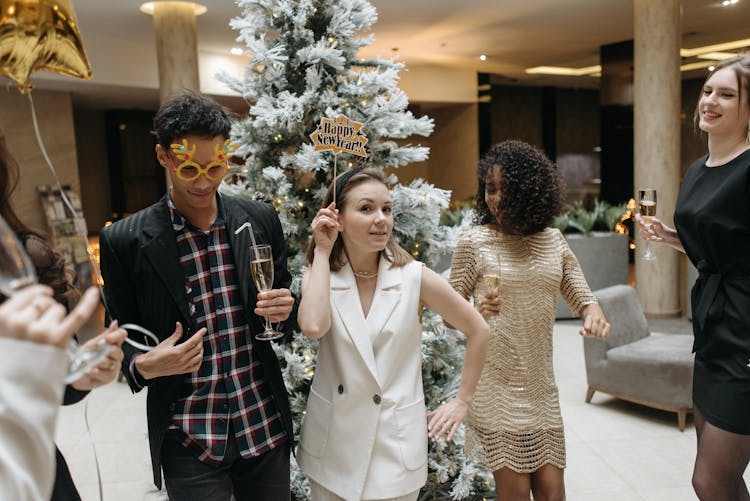 People Standing Near Christmas Tree