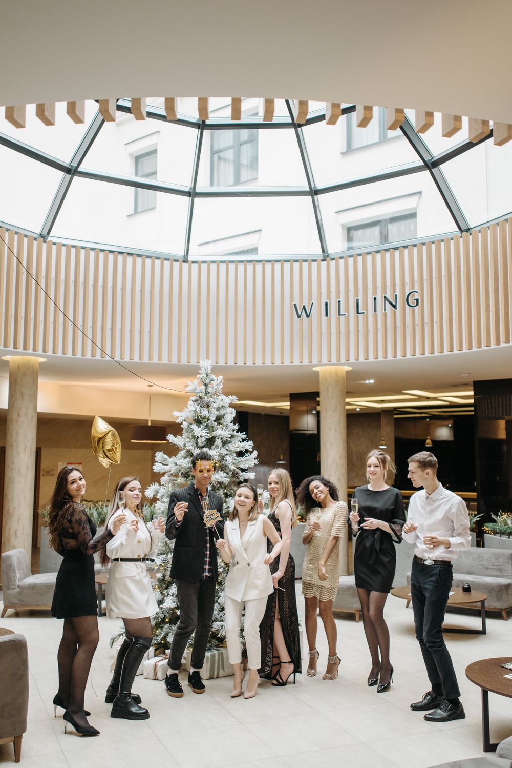A stylish group celebrating indoors with a festive atmosphere