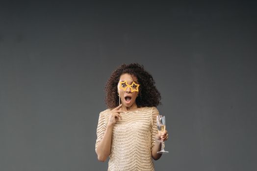 Surprised Woman holding Glass of Champagne