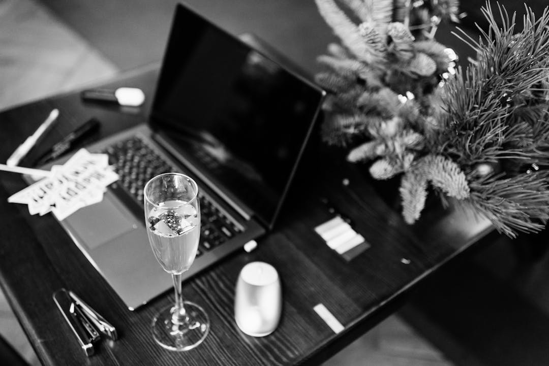 Elegant office celebration scene with champagne and holiday decorations.