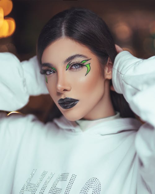 A Beautiful Woman in White Sweater with Eye Makeup