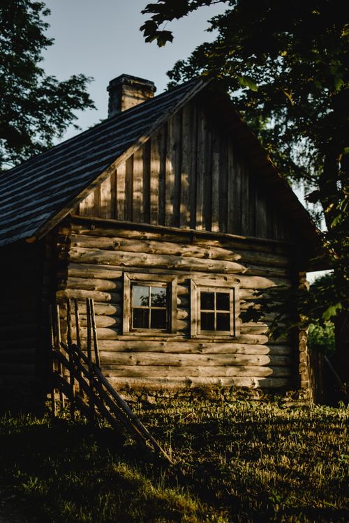 Free Charming rustic cabin set in the serene Estonian countryside. Stock Photo