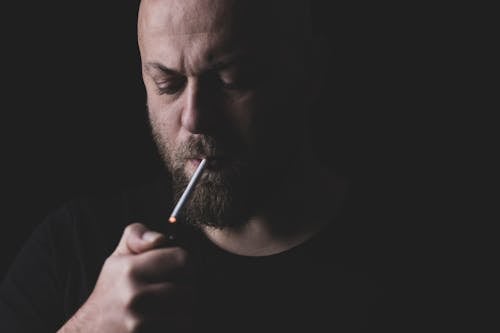 Free Man Lighting a Cigarette Stock Photo