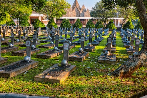 Gravestones with hardhats in heroes cemetery