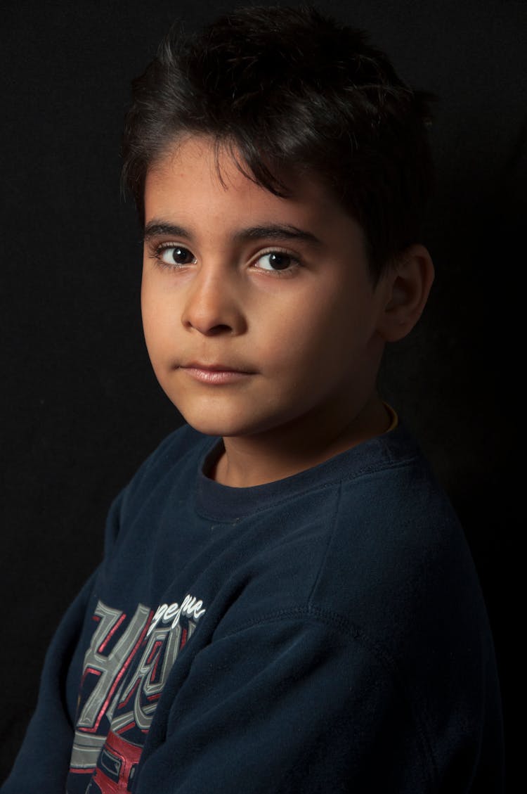 Boy In Blue Shirt Staring