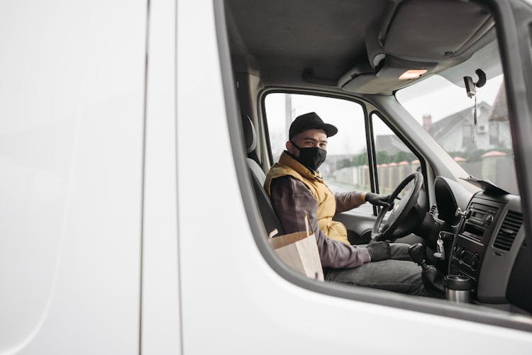 Deliveryman Sitting Inside A Van